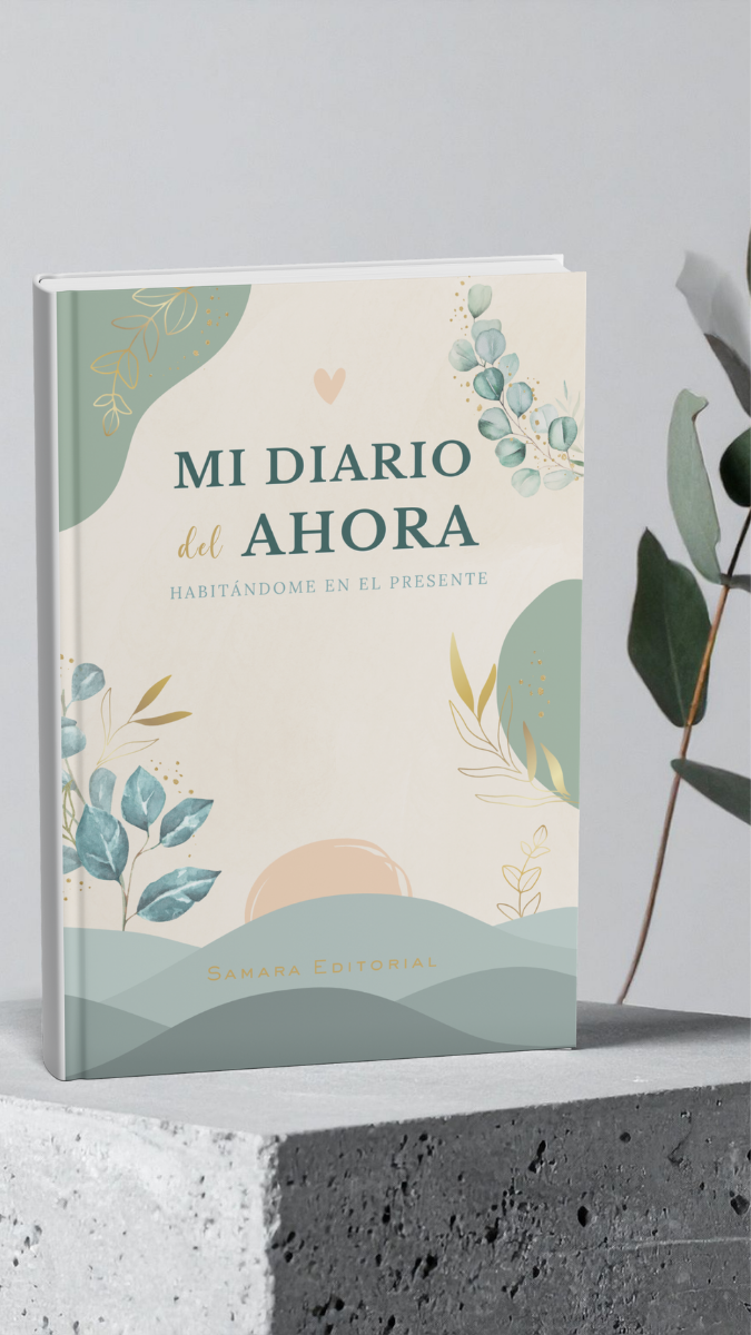 a book opened on top of a bed next to a plant
